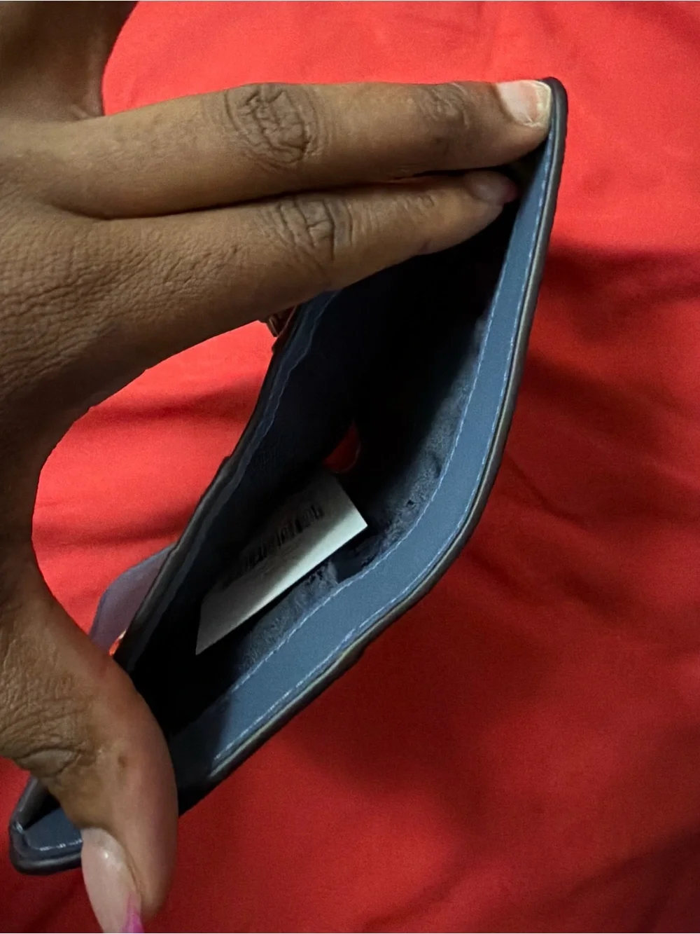 Kate Spade New York blue leather wallet with pebbled texture